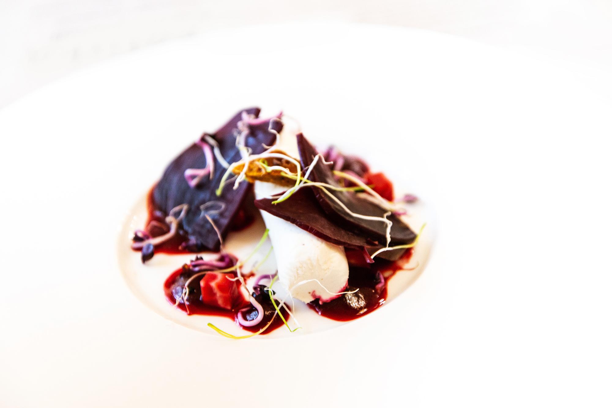 Close-up of plated starter with sauce brush